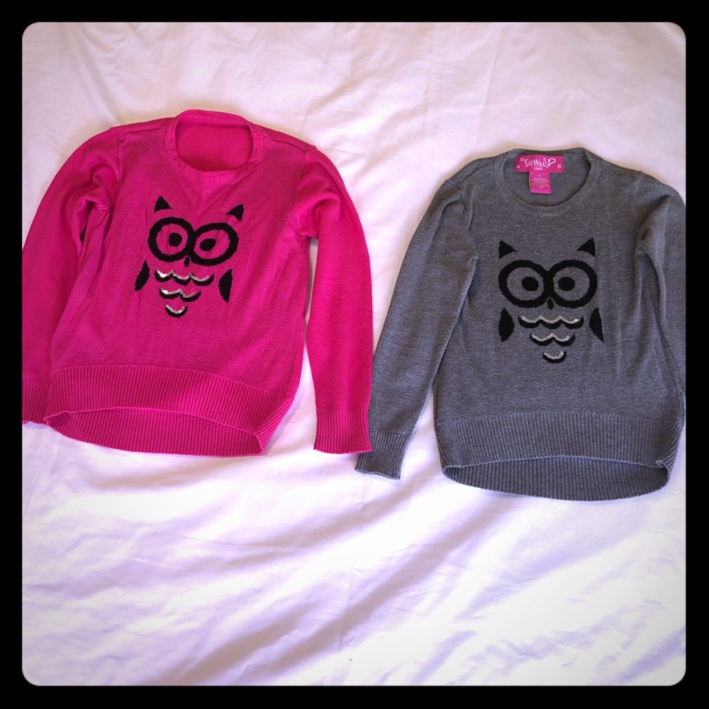 say what ? A pair of girls sweaters